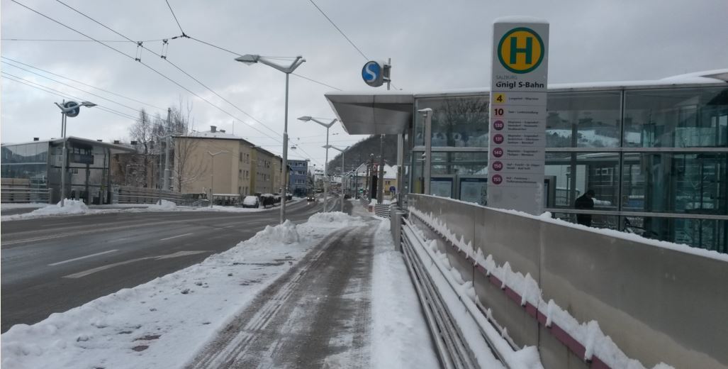 [Salzburg]In Britain there's a tendency to reduce costs by providing just one set of stairs, one lift and one station entrance with one CIS screen. At Salzburg Gnigl station a major road goes over the top of the railway line and the platforms. As there are trolley bus stops (note the overhead wires but absence of tram tracks) on either side of the road it makes complete sense to have station entrances on both sides of the road as well
