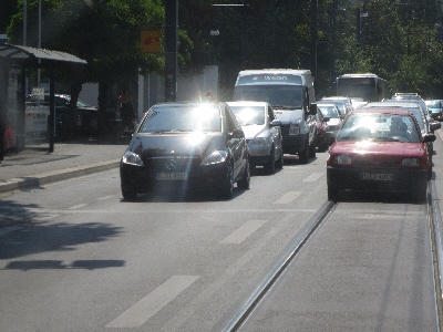 [Berlin]View taken from a tram stopped on street to let people off. The separate coordinated traffic light and road marking has stopped all traffic at a safe distance whilst people leave and cross the road to the pavement safely.  Photo by Ian Brown for Railfuture.