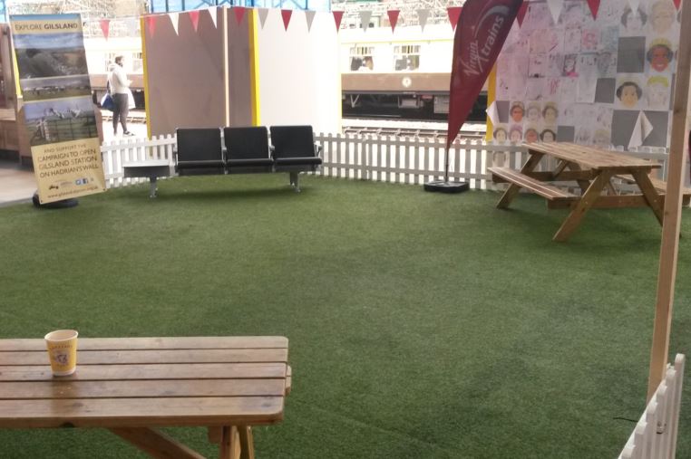 Carlisle station has several enclosed seating areas. This one, which is similar to a pub garden is ideal for families to wait in