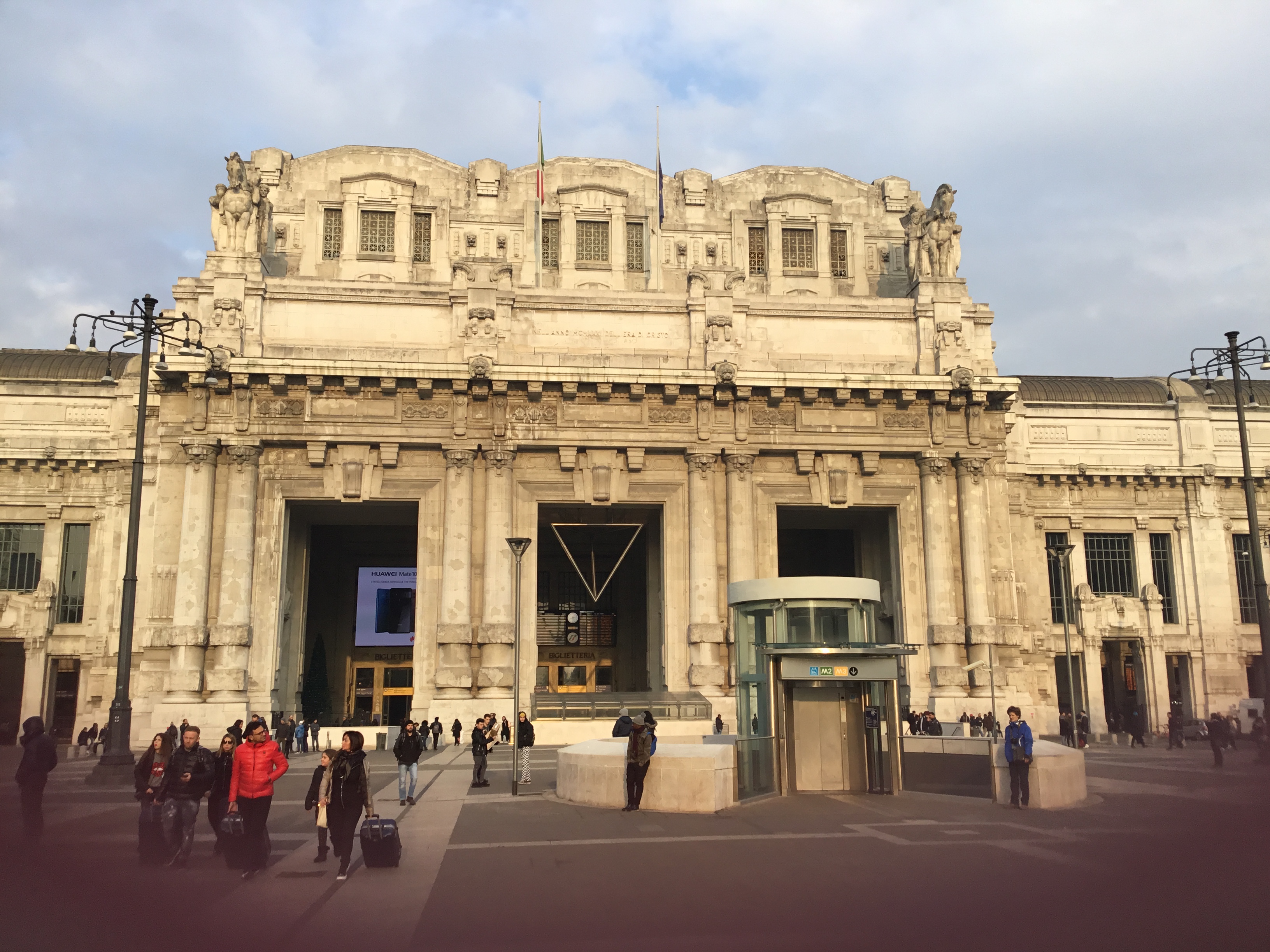 [Milan]Milan Central main line station showing adaption to provide mobility impaired lift from ground level outside the station entrance to the Metro platforms below.  Photo by Ian Brown for Railfuture.