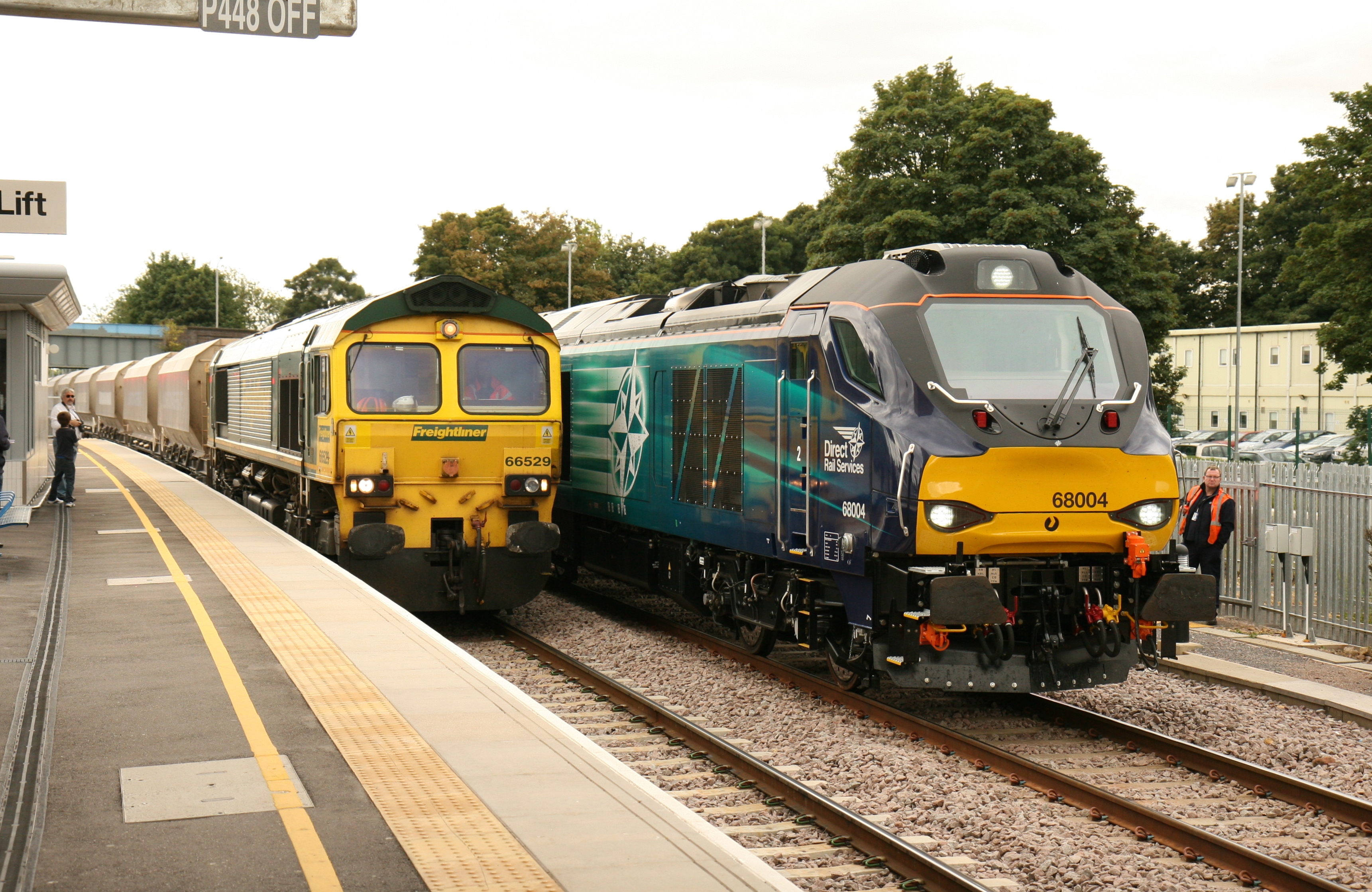 New class 68 No 68004 is seen working from Norwich to Doncaster (seen here at Peterborough) while 66529 brings an empty stone train from March, bound for Mount Sorrel.  Photo by Jim Wade