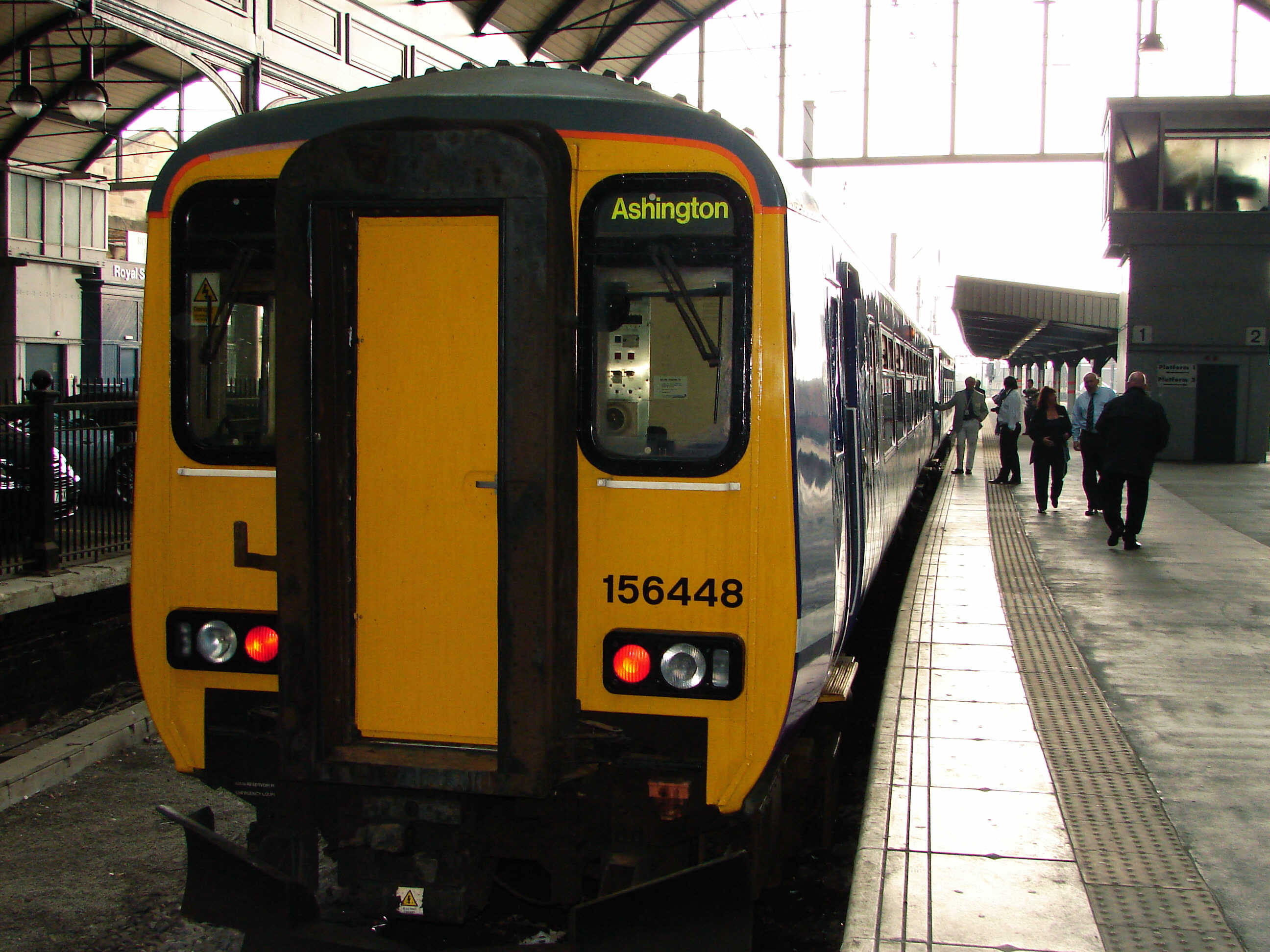 Photo of a charter train at a station (showing destination as Ashington) promoted by SENRUG to campaign for a passenger service on the Ashington, Blyth and Tyne railway line.  Photo by John Brierley with permission via Dennis Fancett